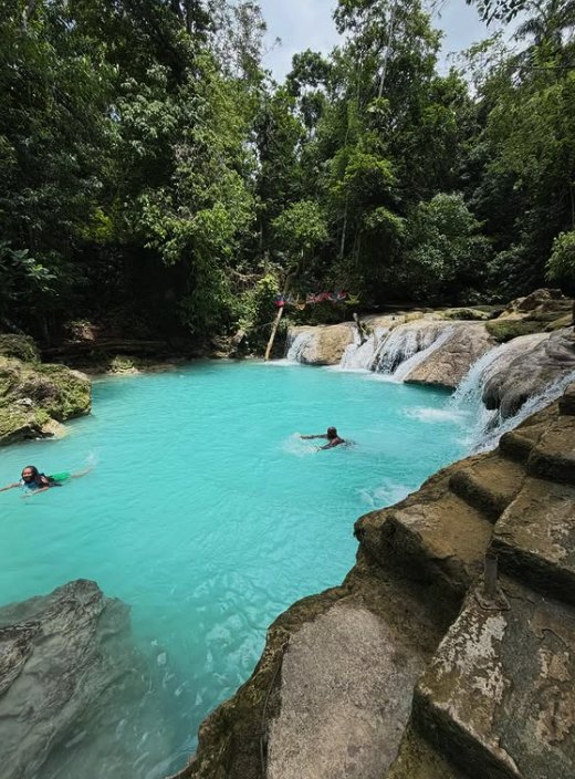 Swimmers in the blue spring water of the Blue Hole near Ocho Rios