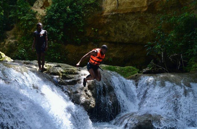 A cliff jump into the spring-fed pools at the Blue Hole near Ocho Rios